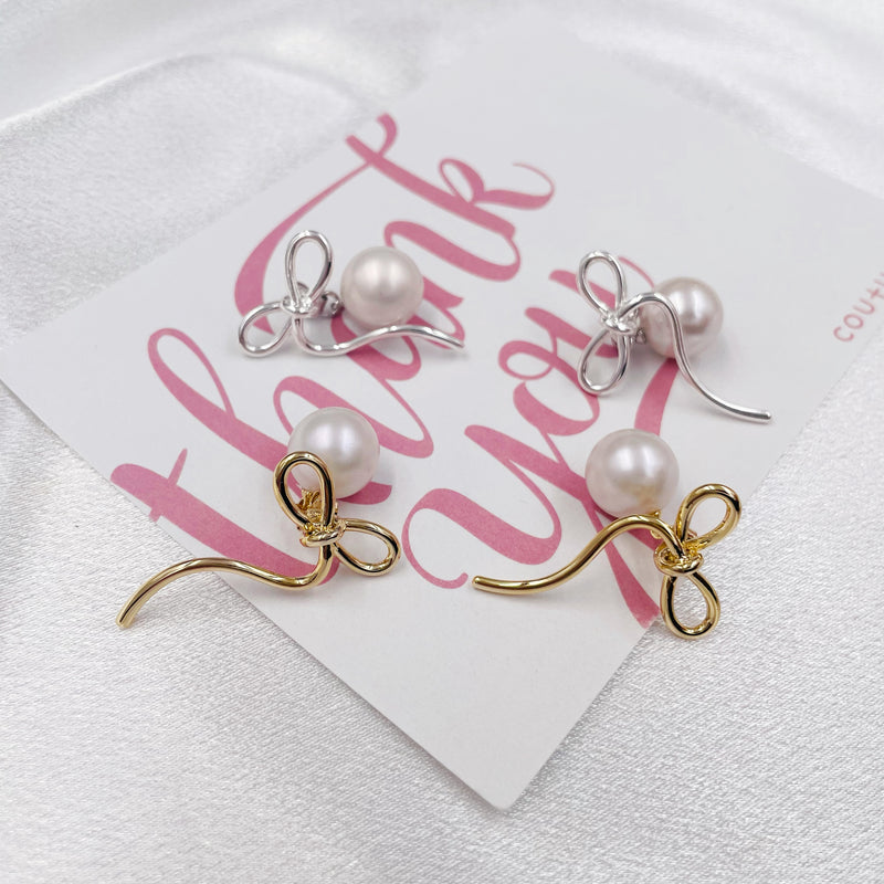 Asymmetrical Bow with Big Pearl Earrings
