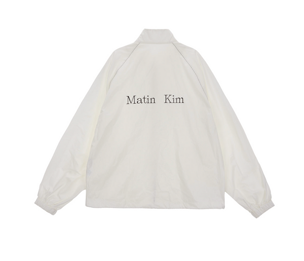 Matin Kim マーティンキム Logo Coating Jumper Matin Kim Logo Coating Jumper in Ivory | Matin Kim | Couturist